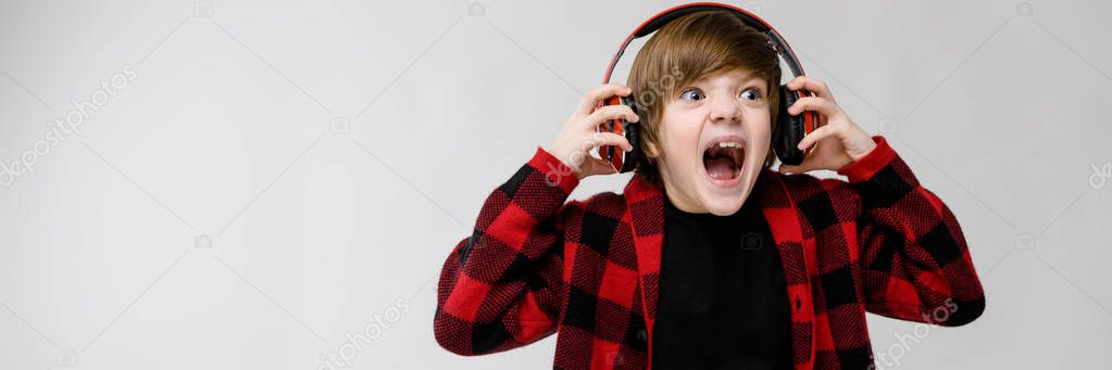Teenage boy in fashionable clother and headphones