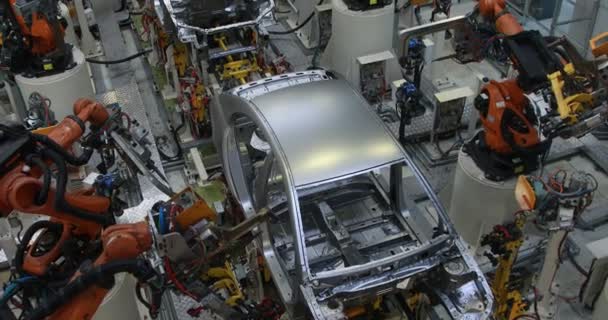 Automotive production line. Welding car body. Modern car Assembly plant — Stock Video