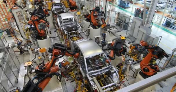 Body of car on conveyor top view. Modern Assembly of cars at the plant. The automated build process of the car body — Stock Video