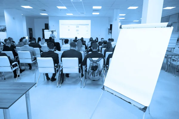 Board on background of audience in conference room. Business concept — Stock Photo, Image