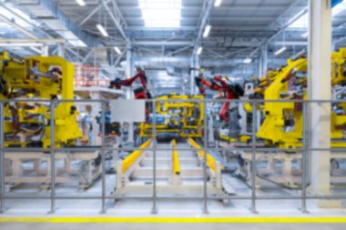 Robot el tarafından derleme aracın arka plan bulanık. Ufuk araba fabrika görüntüsünü