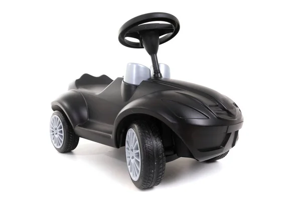 Zwarte speelgoedauto geïsoleerd op witte achtergrond — Stockfoto