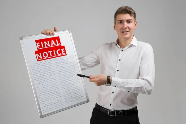 Young man holding final notice isolated on light background