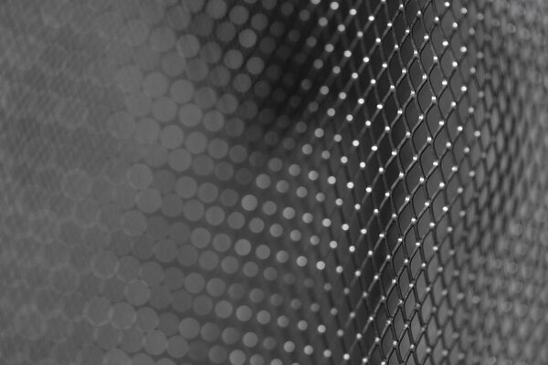Part of the fuzzy Texture of stainless steel. abstract Silver-gray plate. Background-the grid floor. Template for flyer or advertisement. the grey Bars of metal close up. Steel wire mesh seamless as