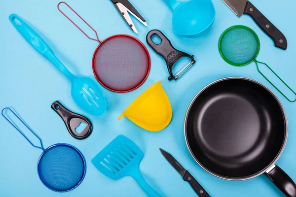 Kitchen utensils isolated on blue background