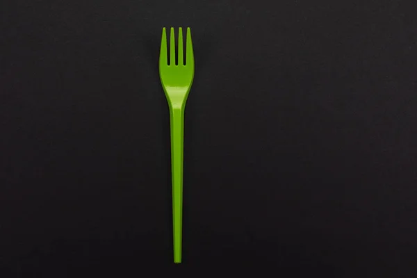 Top-view of disposable green plastic fork isolated on background — Stock Photo, Image