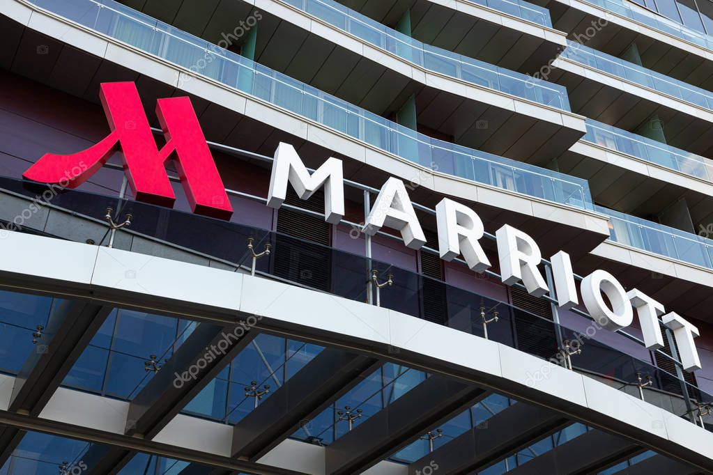 Minsk, Belarus - July, 2019. - Angular close-up of Marriott hotel logotype above entry to hotel