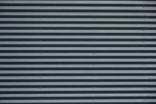 Front View Striped Grey Corrugated Metallic Wall — 图库照片