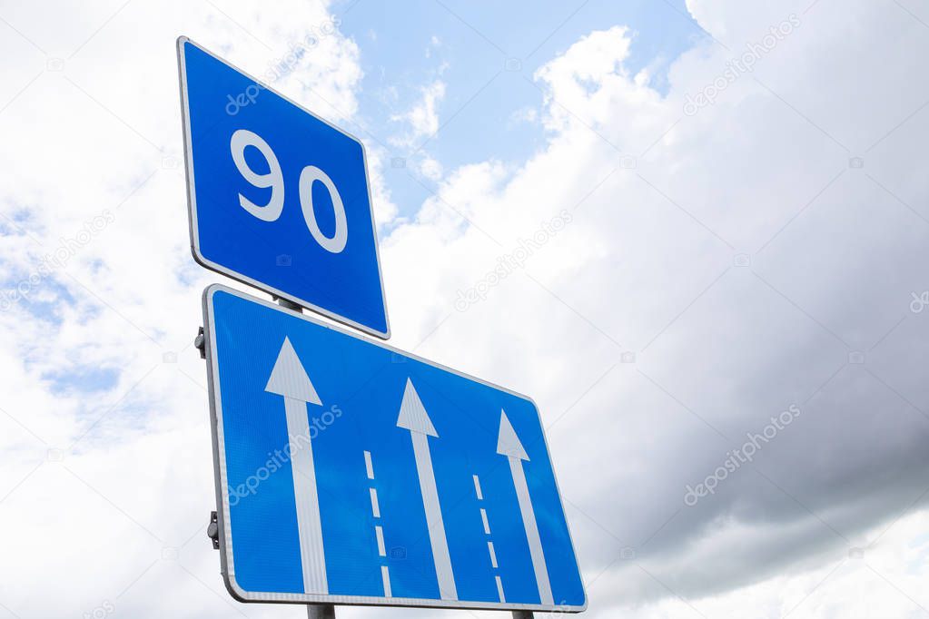 Road sign Low speed limiting 90 km per hour with traffic direction sign