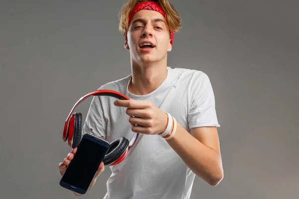 teenager with headphones and phone