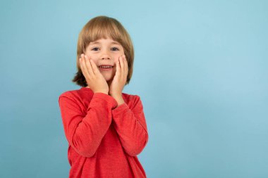 handsome little boy posing in studio