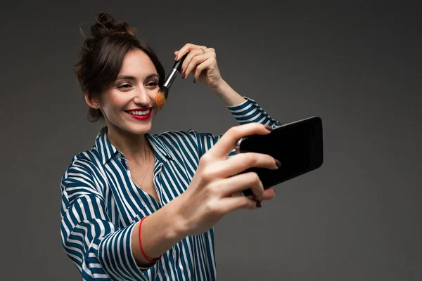 Young Woman Blue White Striped Blouse Smiling Using Black Cellphone — Stock Photo, Image