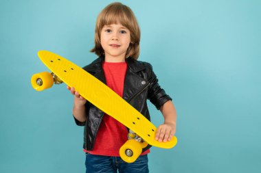 handsome little boy posing in studio