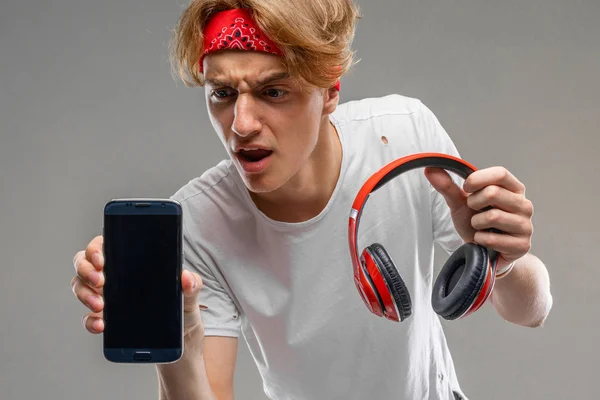 teenager with headphones and phone