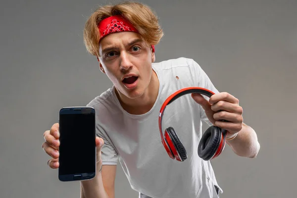 teenager with headphones and phone