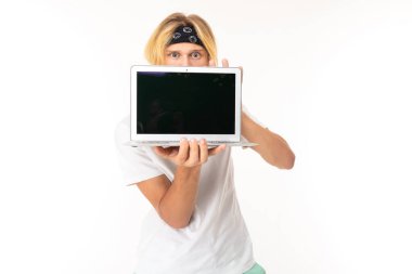 man posing with laptop against white background  
