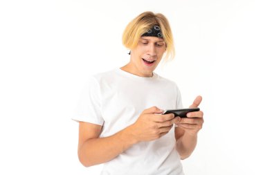 man posing with mobile phone against white background  