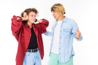 Woman and man posing against white background 