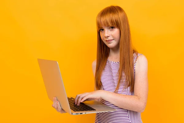 Ginger Cute Girl Laptop Orange Background — Stock Photo, Image