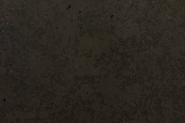 Koyu dokulu yüzey, tasarım projeleri ve sanatsal ifadeler için ilginç bir zemin oluşturarak çeşitli ince desenler ve tonlar sergiliyor. Yaratıcı keşifleri davet eder..