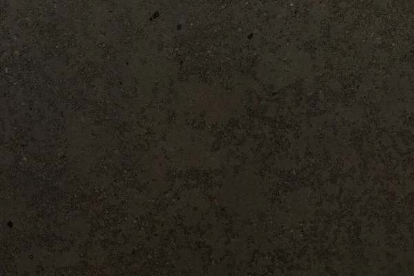 Koyu dokulu yüzey, tasarım projeleri ve sanatsal ifadeler için ilginç bir zemin oluşturarak çeşitli ince desenler ve tonlar sergiliyor. Yaratıcı keşifleri davet eder..