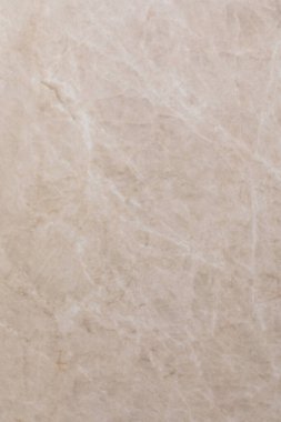 Pürüzsüz, doğal bej mermer yüzey, çeşitli ev dekorasyonu ve tasarım uygulamaları için uygun hassas damarlar içerir. Tezgah ya da döşeme için ideal.