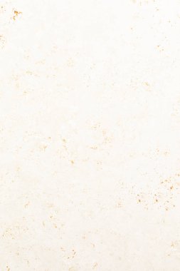 Tarafsız tonlu kağıt arka plan benekleri ve çeşitli tasarım projeleri, el sanatları veya bir fon olarak uygun sıcak bir doku sergiler.