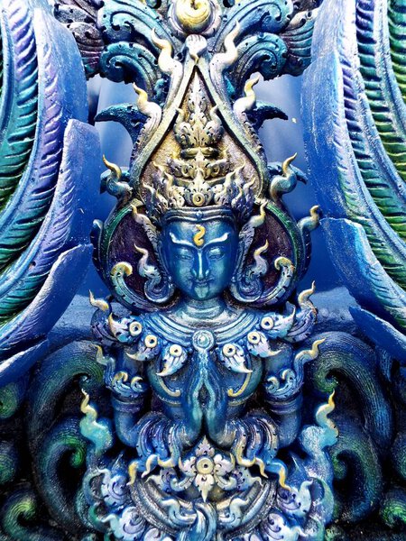 Chiang Rai. Thailand, June 16, 2017: Wat Rong Suea Ten. Detail of one of the blue sculptures on the outside of the Blue Temple in Chiang Rai. Thailand