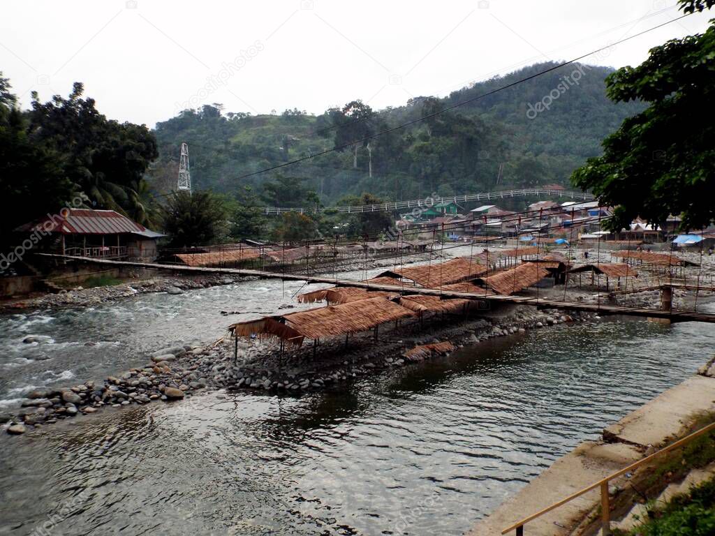 Huts in the middle of the Bahorok River in Bukit Lawang in the North Sumatra province of Indonesia.