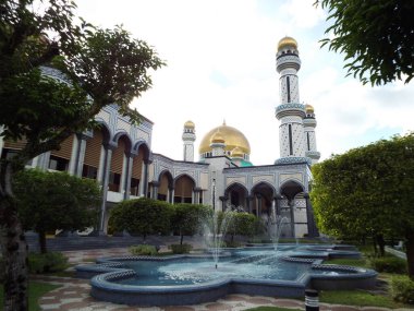 Bandar Seri Begawan, Brunei, January 26, 2017: One of the fountains in the gardens of Jame Asr Hassanil Bolkiah Mosque in Brunei clipart