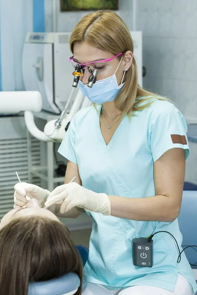 Girl Dentist Dental Seal Installation