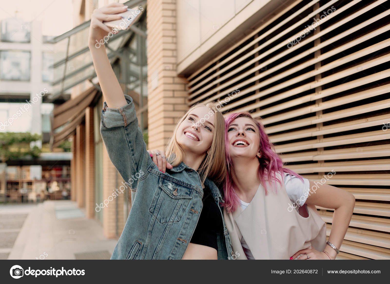 Happy Best Friends Pose For Making Selfie, Hold Smart Phone, Smile Gently,  Enjoy Recreation Time, Wears Casual T Shirt And Sunglasess, Have Good  Relatonship. People, Lifestyle, Technology Concept Stock Photo, Picture and