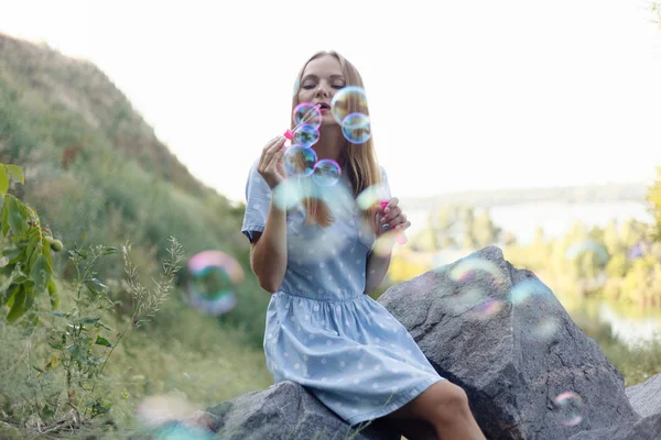 Girl Blowing Soap Bubbles Young Beautiful Woman Sits Grass Park — Stock Photo, Image