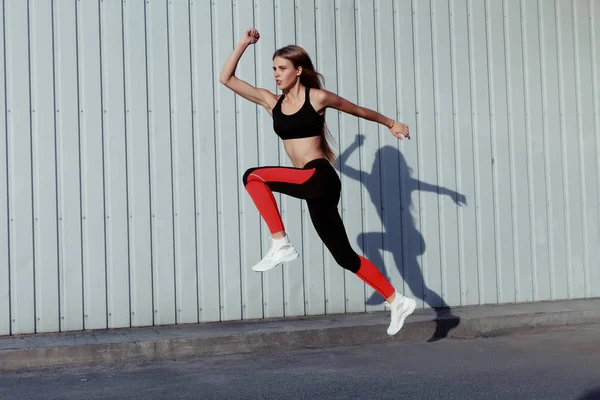 Sportswoman Jumping Stretching Full Length Healthy Female Exercising Jumping Outdoors — Stock Photo, Image