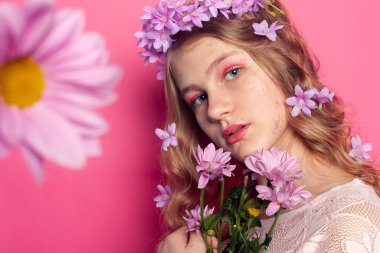 Romantic female portrait with flowers, symbol of natural elegance, seasonal style and feminine beauty.