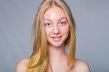 Portrait of adolescent girl with minimal makeup, symbol of authenticity, honesty and natural charm.