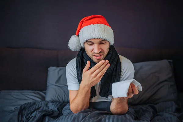 Sick Young Man Red Hat Sits Look Tissue Has Hand — Stock Photo, Image