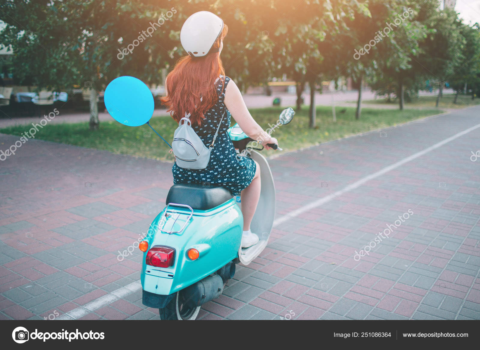 girls driving scooty