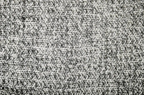 Warm wool gray knitted crumpled plaid. Texture, background. — Stock Photo, Image