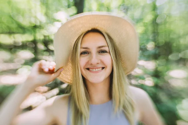 beautiful young woman in hat outdoor