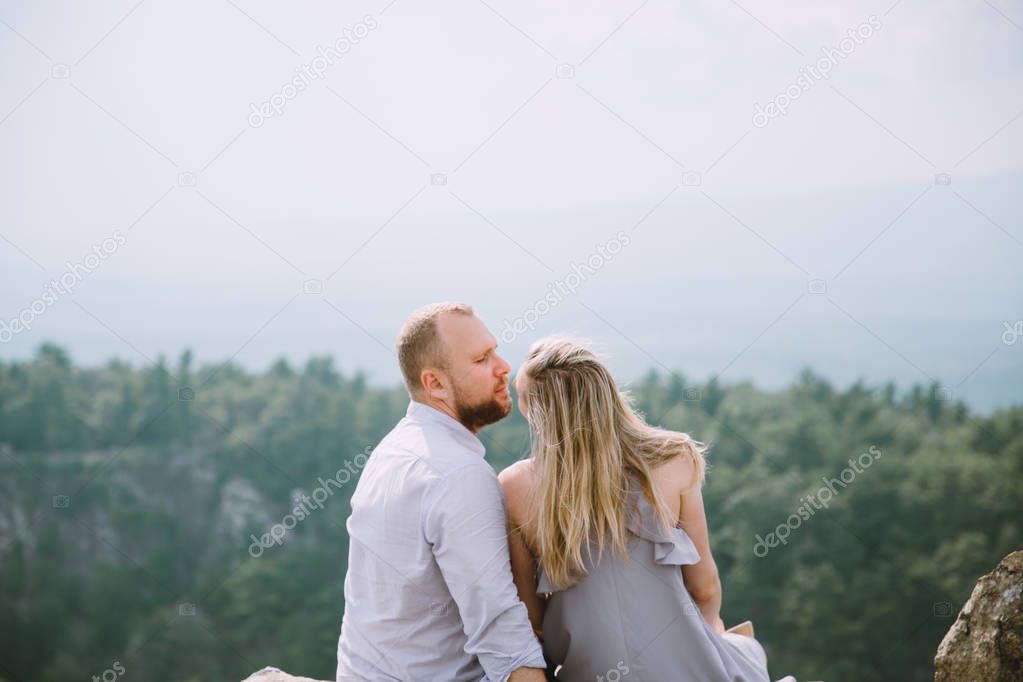 happy love couple looking at summer landscape 