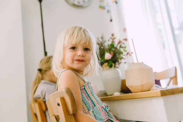 Adorable Little Girl Drinking Coconut Milk Home — Stock Photo, Image