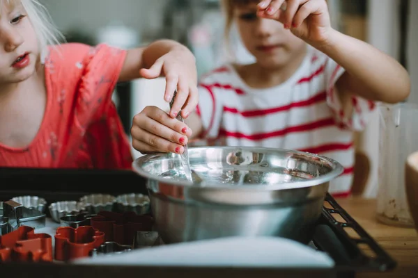 Two cute little sisters cooking at home — Stock Image Two Cute Little Sisters Cooking Home Stock Image
