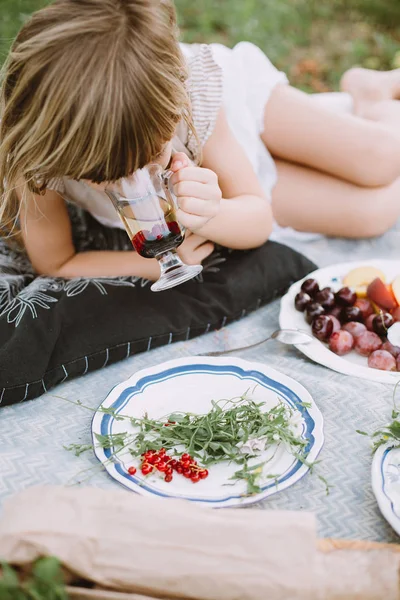 Little Girl Drinking Cup Tea Berries Lying Blanket Garden — Stock Photo, Image