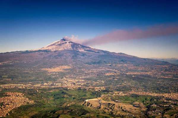 Ash plume coming from volcano mount Etna during the eruption of january 2018 viewed from the airplane after departing from Catania airport, flying over Sicily