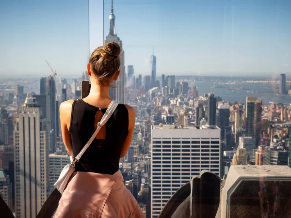 Cute girl taking photos of the Skyline of Manhattan from the Roc Stock Image