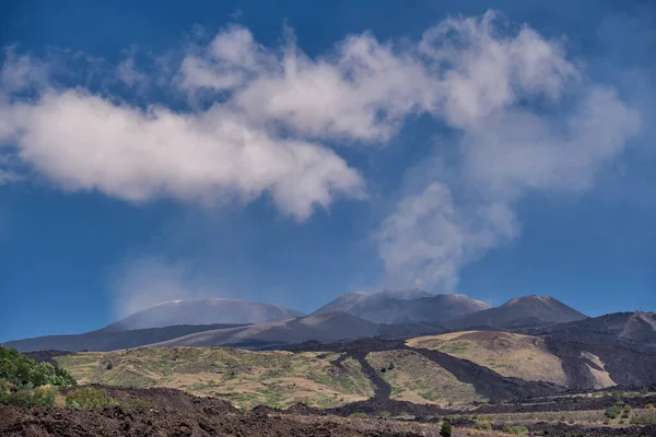 Active volcano Mount Etna erupting ash plume, Sicily, Italy.