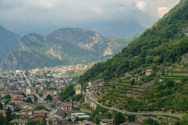 Historic Pont-Saint-Martin panorama in Valle Aosta Italy. Scenic Alps, medieval architecture, riverside charm, and cultural heritage.