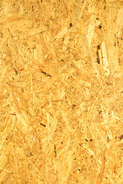 OSB boards made of wood chips, brown wood floors. Top view of OSB wood veneer surface smooth and smooth, white background.