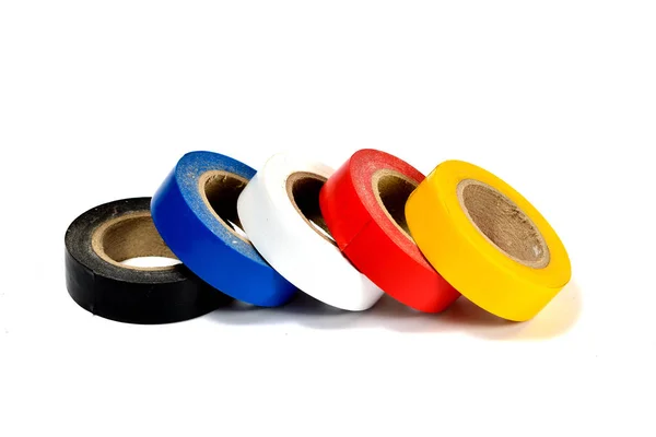 Several coils of colored tape (insulating tape) on white background